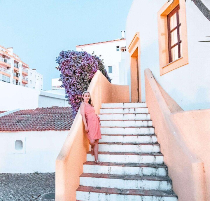 standing on a yellow staircase in Lagos, Portugal