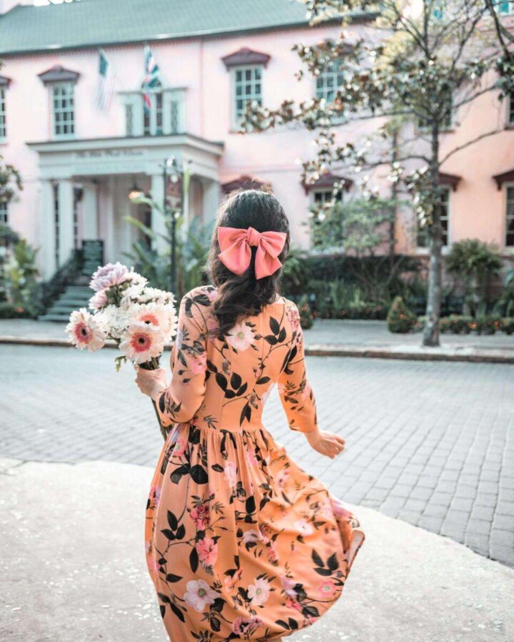 girl in floral dress at the Olde Pink House, Savannah