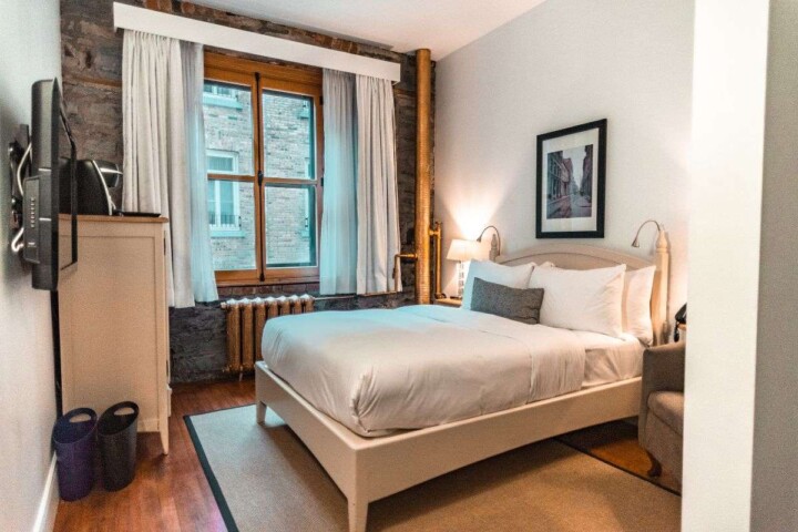 Are you trying to decide where to stay in Quebec City? This guide to the best Quebec City boutique hotels has you covered. Whether you&rsquo;re looking for a historic stay along the old port in the lower town or you&rsquo;re dreaming of a spectacular view of the St. Lawrence River in Quebec City&rsquo;s upper town, you&rsquo;ll find it all here. Come discover your home-away-from-home with these beautiful, centrally-located Quebec City hotels! #besthotelsinquebeccity #oldquebeccityhotels