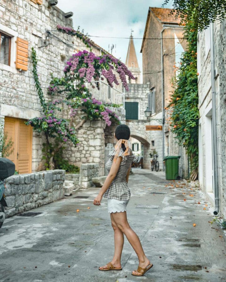 Are you dreaming of visiting Hvar island, Croatia but debating whether to spend more time in Hvar Town or Stari Grad? While these two towns are equally gorgeous, each has its own unique vibe. Fortunately, this guide breaks down everything you need to know about these two popular Hvar towns so that you can build the perfect Hvar itinerary. Discover everything from the key differences, to the top activities, to the best modes of transportation. #starigradhvaroldtown #starigradhvar #hvartowncroatia