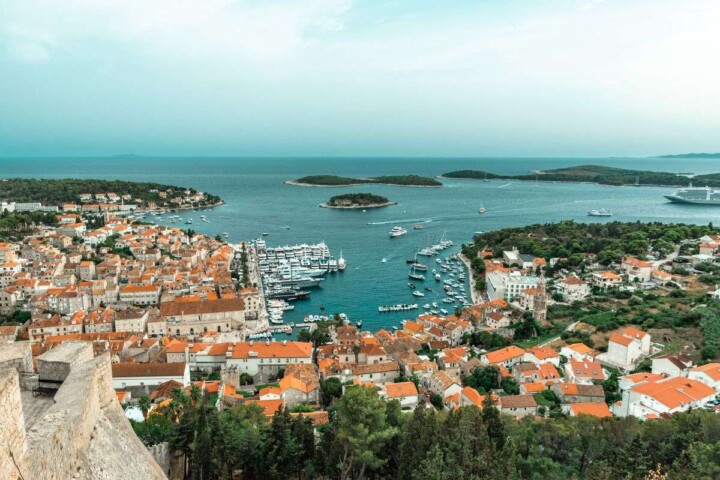 Are you dreaming of visiting Hvar island, Croatia but debating whether to spend more time in Hvar Town or Stari Grad? While these two towns are equally gorgeous, each has its own unique vibe. Fortunately, this guide breaks down everything you need to know about these two popular Hvar towns so that you can build the perfect Hvar itinerary. Discover everything from the key differences, to the top activities, to the best modes of transportation. #starigradhvaroldtown #starigradhvar #hvartowncroatia