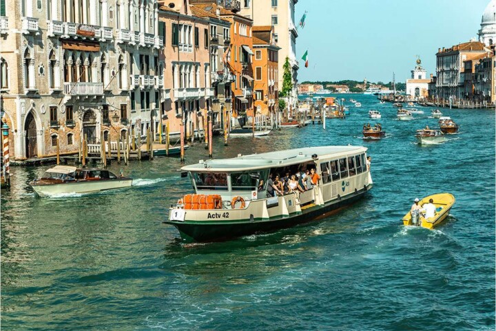 Wondering how to get around Venice? From vaporetti, to private water taxis, to walking tips, here’s how to navigate Venice like a pro! #veniceboatride #venicegondolaride #vaporettovenice